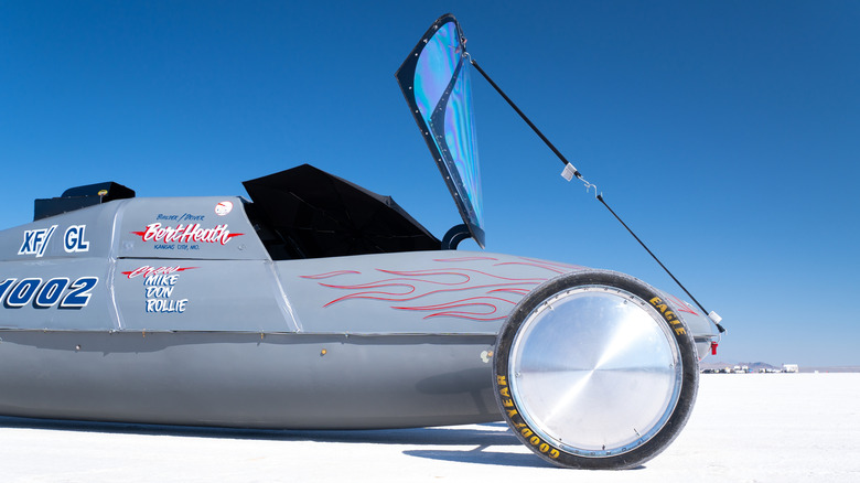 A land speed record vehicle parked on Boneville Salt flats with Goodyear tires.