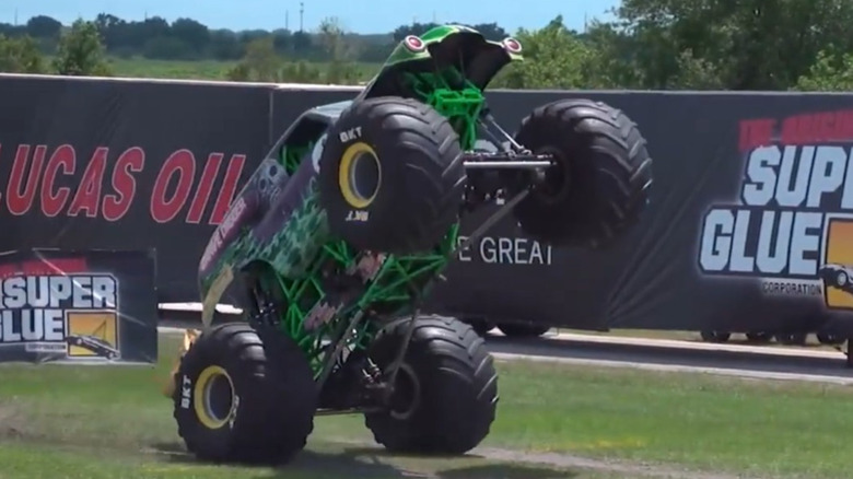 The Grave Digger monster truck with BKT tires performing tricks at Monster Jam
