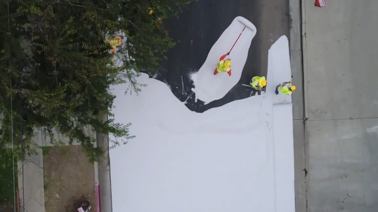 LA workers painting a street white