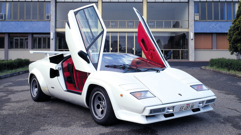 White Lamborghini Countach with the scissor doors opened front 3/4 view
