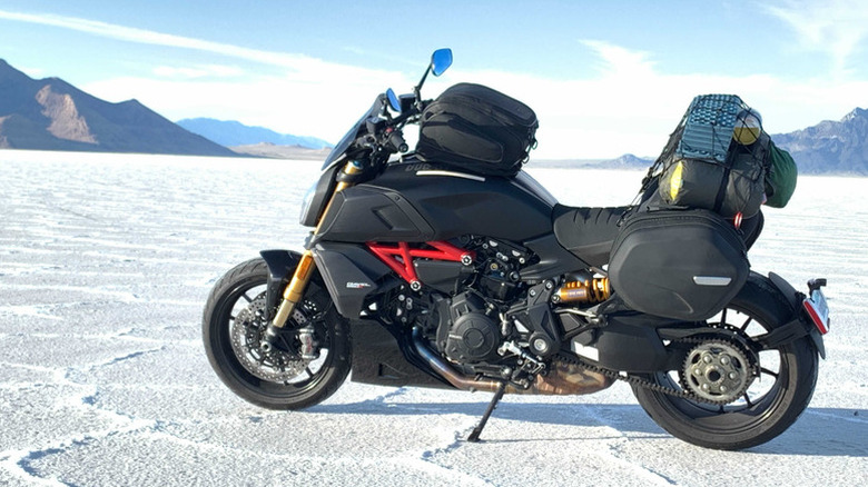 A camping setup on a Ducati Diavel at the Bonneville Salt Flats