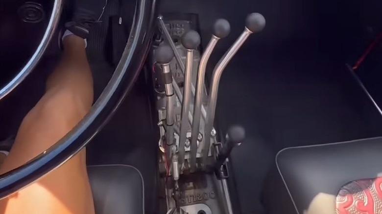 An interior view of a 1946 Mercury Hot Rod with a Lenco Shifter on the floor