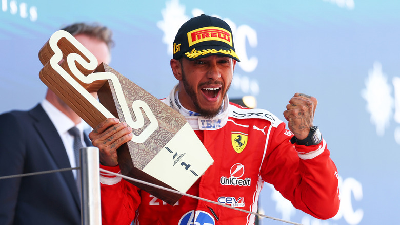 Race winner Lewis Hamilton of Great Britain and Scuderia Ferrari celebrates on the podium with his trophy during the F1 Grand Prix of Barcelona-Catalunya at Circuit de Barcelona-Catalunya on June 14, 2026 in Barcelona, Spain.