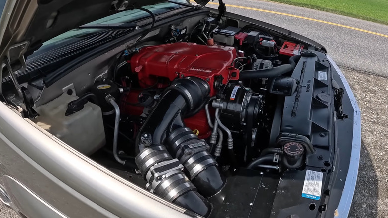 A golden color 1999 Lingenfelter Suburban with a 9.9-liter V8 engine