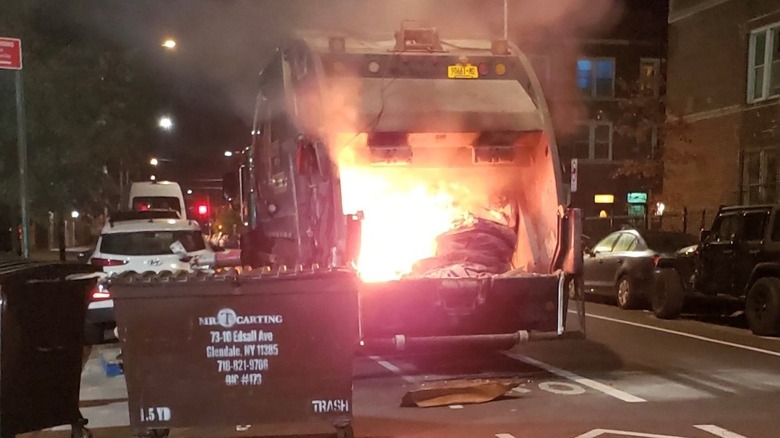 A garbage truck on fire in NYC.