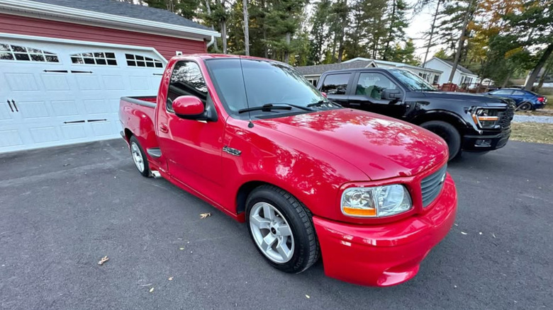 Front three-quarter view of a red Ford SVT Lightning pickup truck