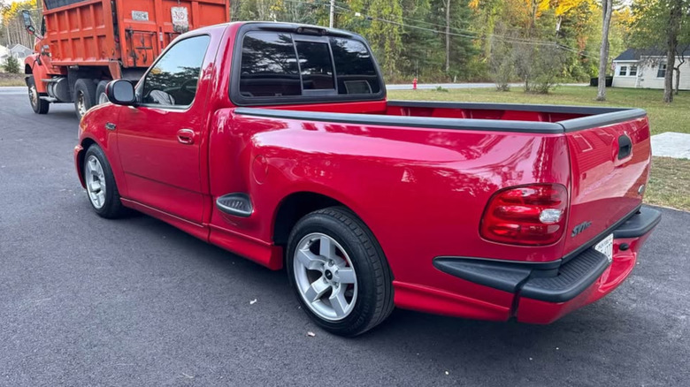 Rear three-quarter view of a red Ford SVT Lightning pickup truck