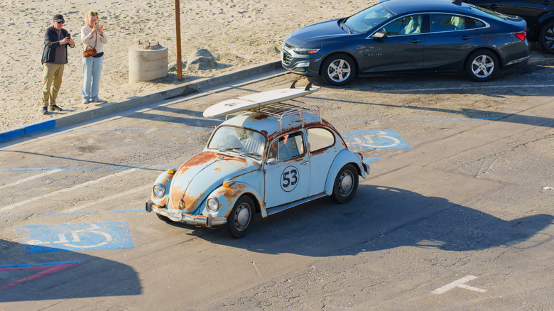 Rusty Volkswagen Beetle near the ocean.