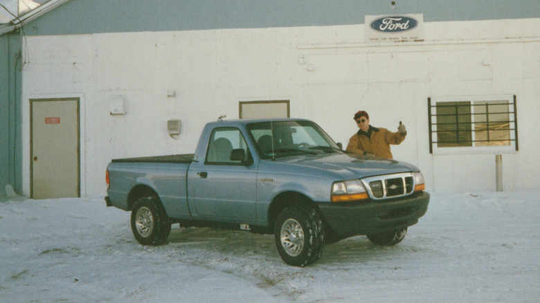Vintage photo of Ford Ranger EV with GM engineer Daniel Schumann during cold-weather testing in Bemidji, Minnesota