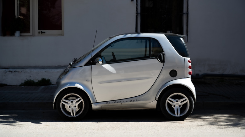 A Smart ForTwo car parked in gray color