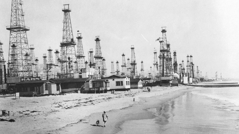 An abundance of oil derricks on a beach in Venice, California, USA. (Photo by © Hulton-Deutsch Collection/CORBIS/Corbis via Getty Images)