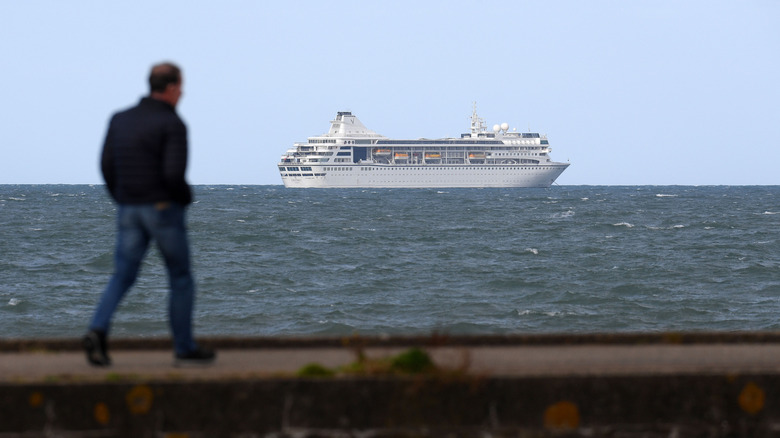 The Villa Vie Odyssey is seen off the Northern Irish coast having departed Belfast on Monday evening, only to announce it would return to port in Belfast on Tuesday to complete administrative paperwork.
