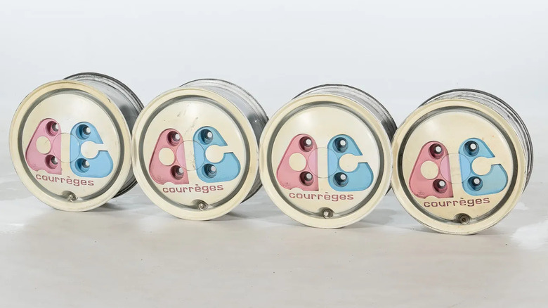 A photo of all four wheels standing next to each other in front of an all-white backdrop