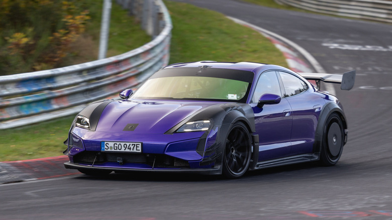Front 3/4 view of a purple Porsche Taycan Turbo GT with Manthey Racing kit