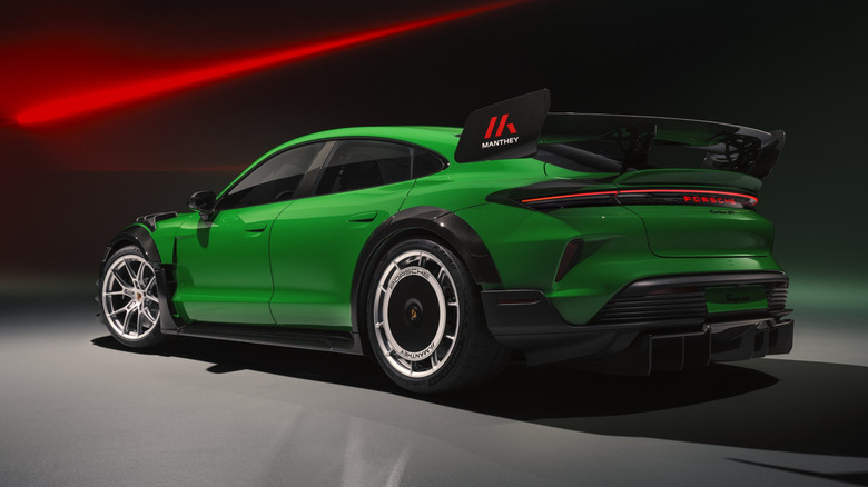Rear 3/4 view of a green Porsche Taycan Turbo GT with Manthey Racing kit