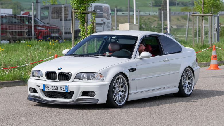 A 1999 BMW M3 E46 with someone inside