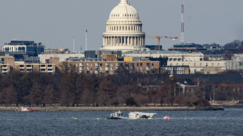 Emergency response units work at the crash site of the American Airlines plane on the Potomac River after the plane crashed last night on approach to Reagan National Airport on January 30, 2025 in Arlington, Virginia.