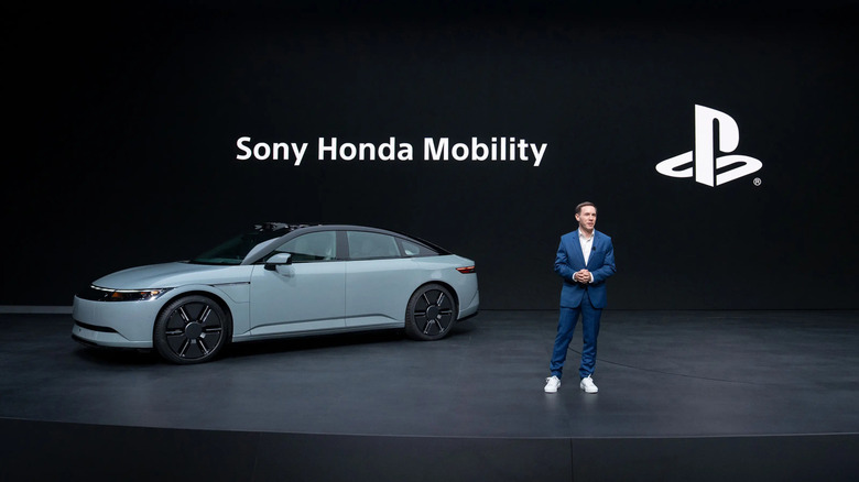 Eric Lempel, SVP, Business and Product, Sony Interactive Entertainment, talks about the Afeela in front of the car on stage at CES