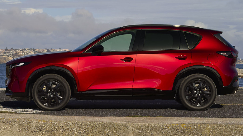 A red 2026 Mazda CX-5 parked on a pier