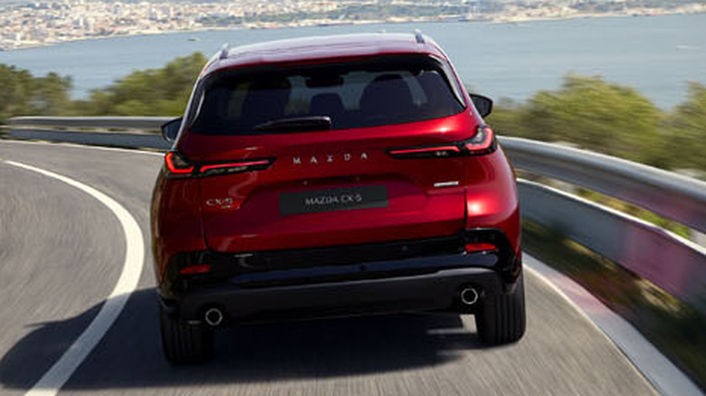 Rearview of 2026 Mazda CX-5 on a coastal highway