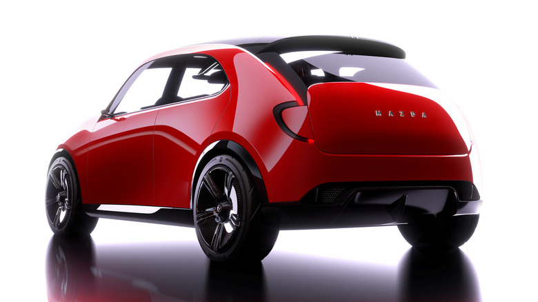 A render of a rear three-quarters shot of the red Vision X-Compact in front of a white background