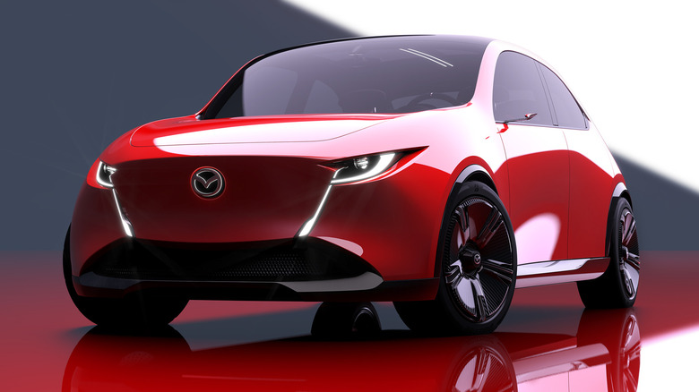 A render of a front three-quarters view of the red Mazda Vision X-Compact