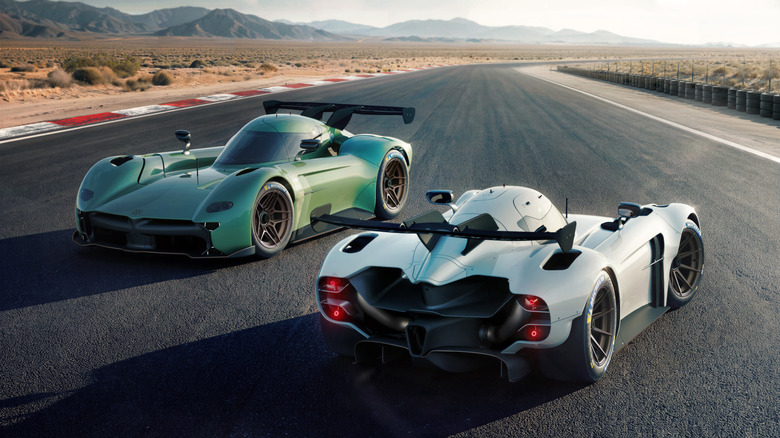 A pair of The McMurtry Spéirling parked on a desert race track