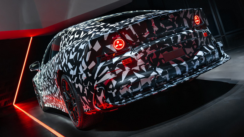Rear end of a camouflaged Mercedes-AMG GT 4-Door Coupe EV