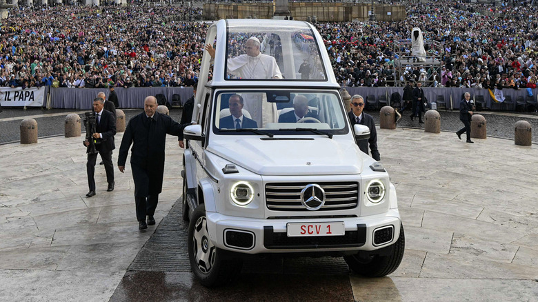 Pope Leo XIV rides his Mercedes G580 Popemobile home to the Vatican from the hospital on October 21, 2026