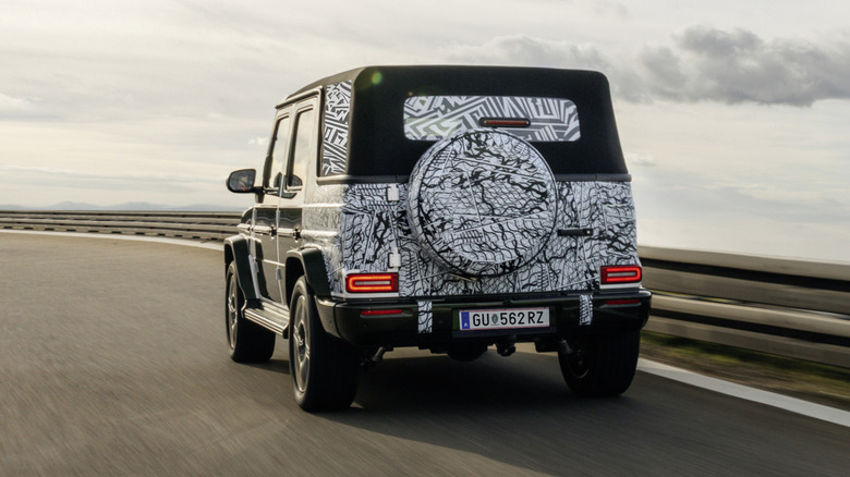 Rear 3/4 view of a camouflaged Mercedes-Benz G-Class Cabriolet prototype