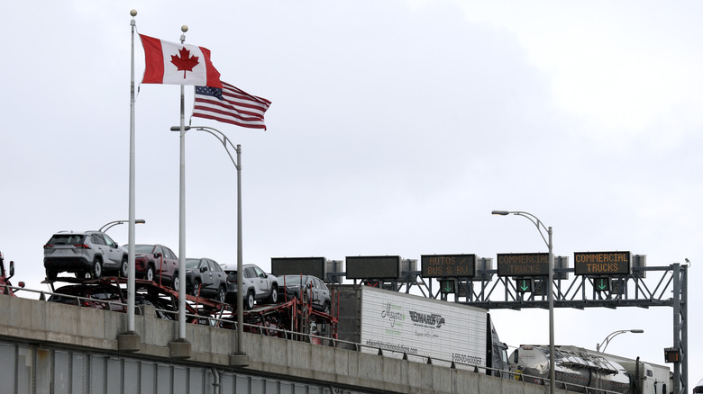 Commercial trucks cross the Lewiston-Queenston Bridge border crossing into the United States on February 04, 2025 in Niagara Falls, Canada. U