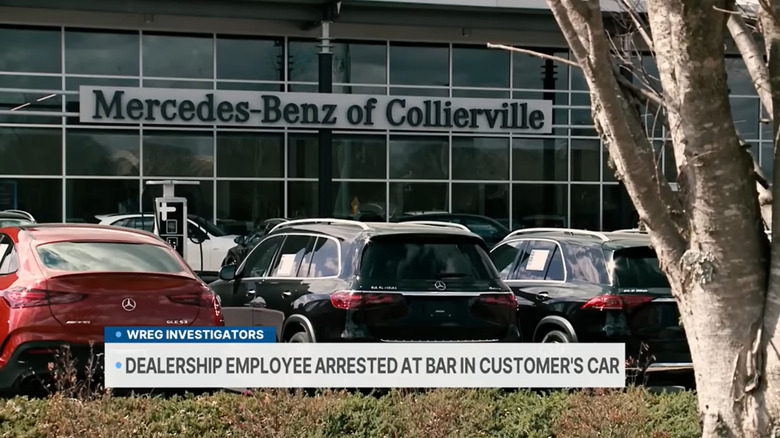 A screenshot from a news broadcast showing the exterior of Mercedes-Benz of Collierville