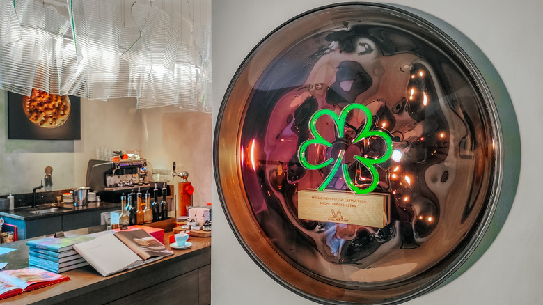 The  Michelin Green Star is displayed on the wall of a restaurant.