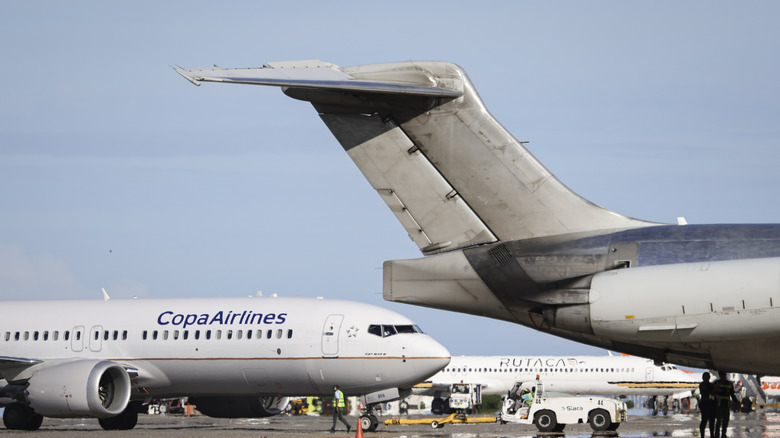 Planes remain parked at Simon Bolivar International Airport on December 03, 2025 in La Guaira, Venezuela.
