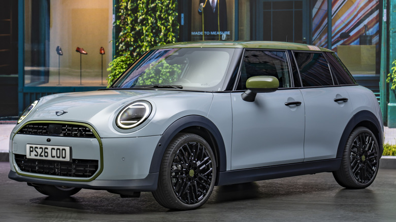 A front three quarters shot of a Statement Grey Mini Cooper S Four-Door hard top parked in front of a Paul Smith store