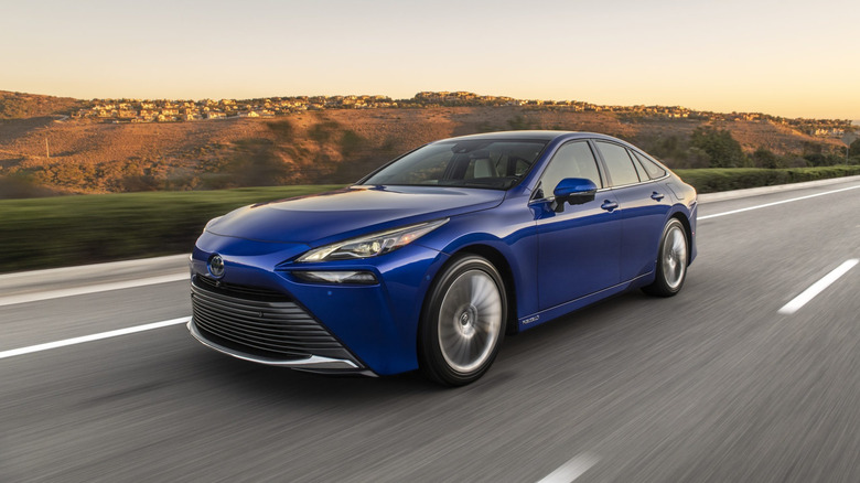 2023 Toyota Mirai front 3/4 view driving on a highway