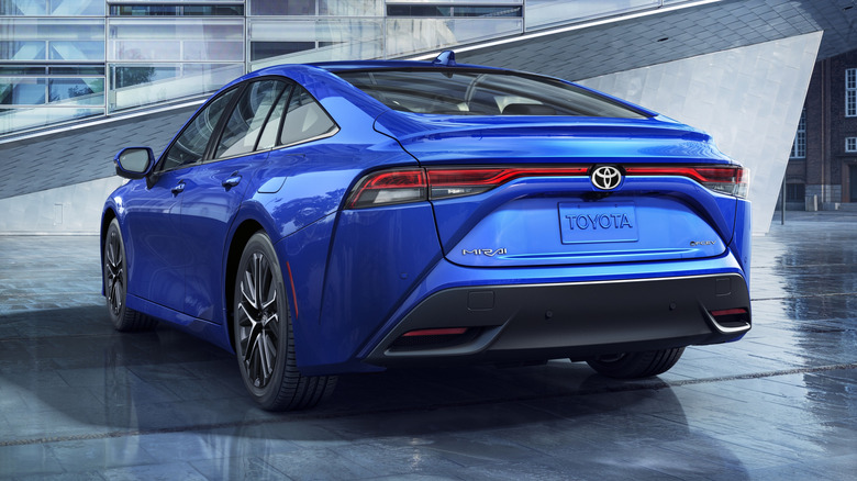 2026 Toyota Mirai rear 3/4 view with a building in the background