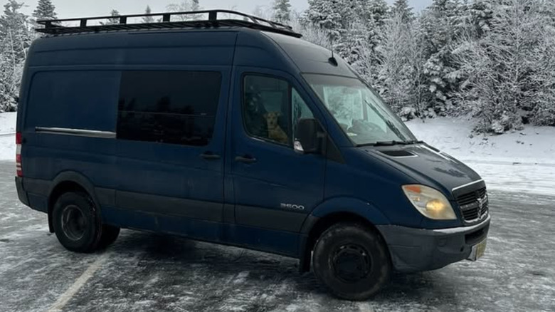 A blue Dodge Sprinter van