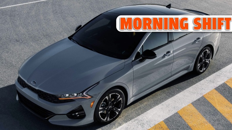 a Kia K5 sedan parked on pavement