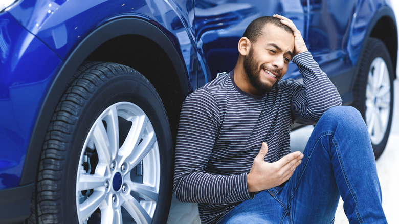 Guy sad about car dead