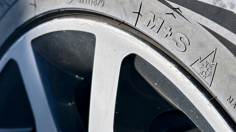 Photo of a tire sidewall with M+S and 3PMSF (three-peak mountain snow flake) markings
