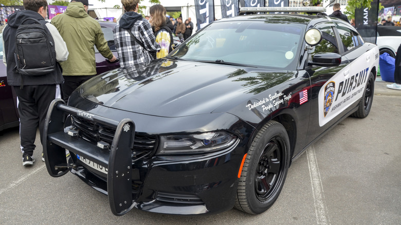 A Dodge Charger Interceptor police car parked on display.
