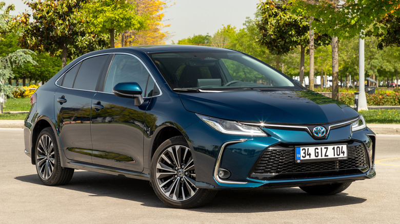 A blue Toyota Corolla sitting parked.