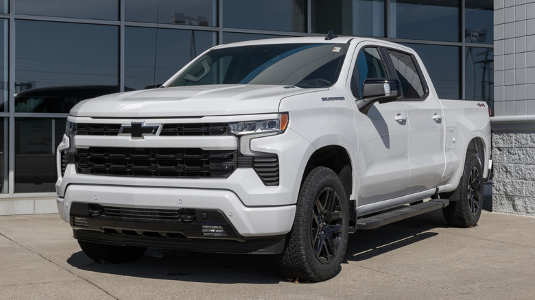 A white Chevrolet Silverado parked on a dealership lot
