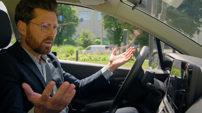 A driver frustrated with the GPS navigation system in their car.