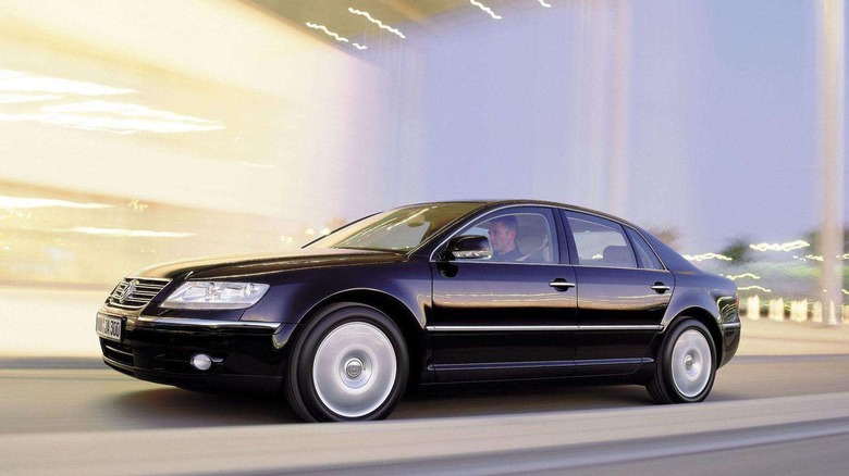 a black Phaeton driving with a blurred background