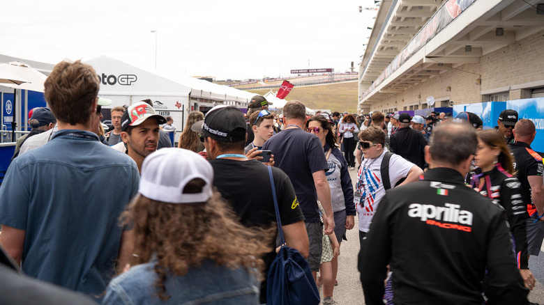 A crowd at MotoGP in the Austin paddock