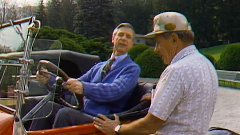 Mister Rogers in an old car
