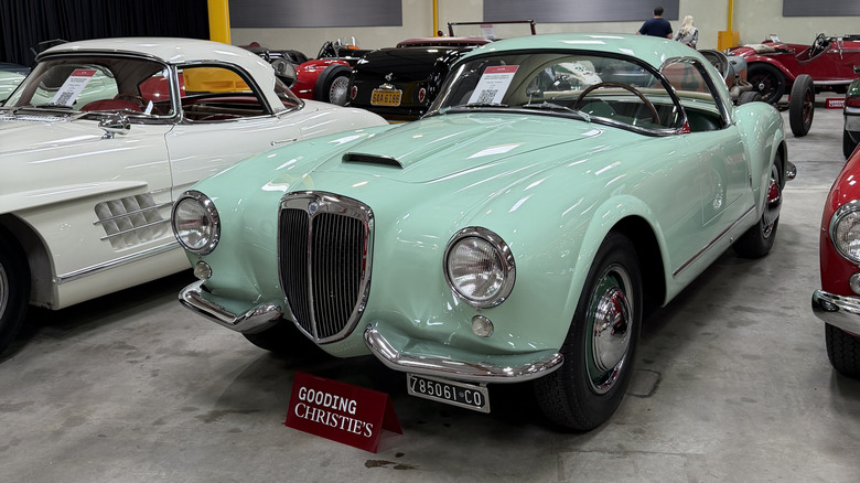 Front 3/4 view of a green 1955 Lancia Aurelia B24S Spider America