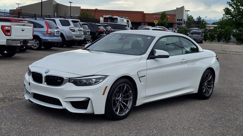 a 2020 M4 convertible parked in a parking lot